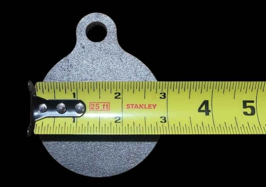 3 inch AR500 steel gong target measured at 3 inches wide with a tape measure