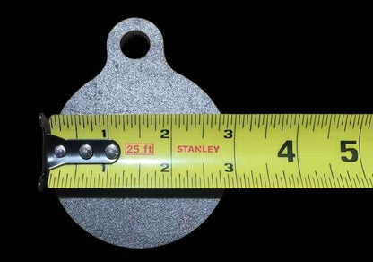 3 inch AR500 steel gong target measured at 3 inches wide with a tape measure