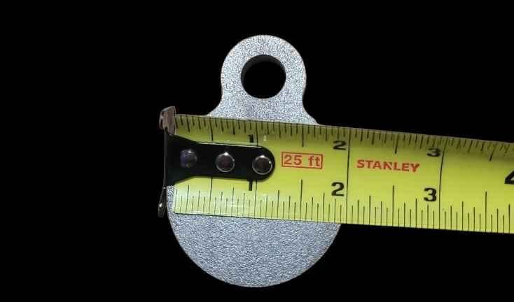 2 inch AR500 steel gong target measured at 2 inches wide with a tape measure