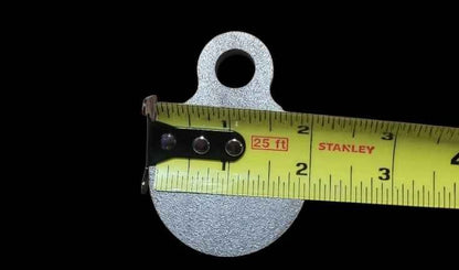 2 inch AR500 steel gong target measured at 2 inches wide with a tape measure